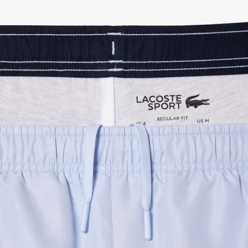 Lacoste Tennis>Gefutterte Tennis Trainingshosen Hellblau / Navy Blau X1J