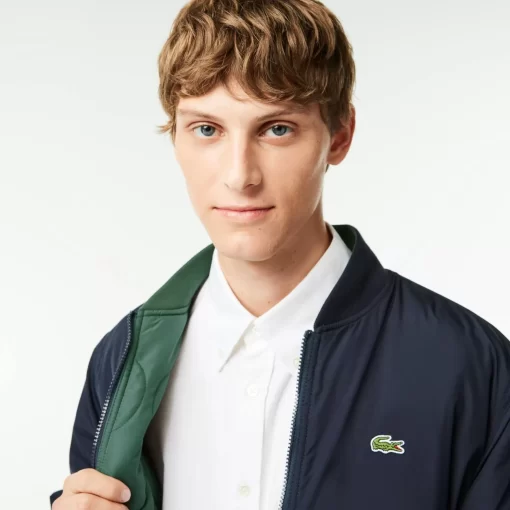 Lacoste Jacken & Mäntel>Gesteppte Herren-Wende-Bomberjacke Navy Blau / Dunkelgrun Mi7