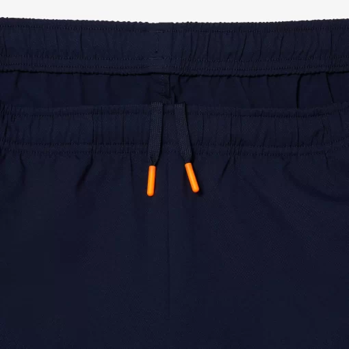 Lacoste Tennis>Herren Tennis Jogger-Set Navy Blau / Orange Xig