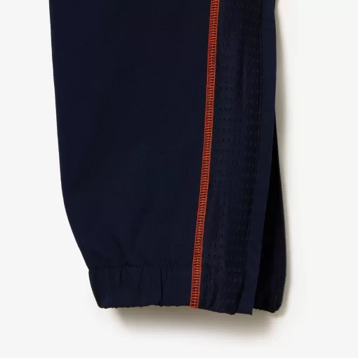 Lacoste Tennis>Herren Tennis Jogger-Set Navy Blau / Orange Xig