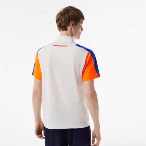 Lacoste Tennis>Herren Tennis Poloshirt Aus Recyceltem Polyester Weis / Blau / Orange 9Tg