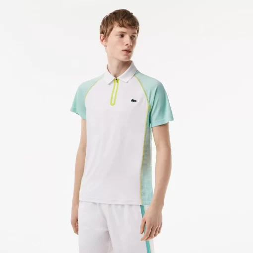 Lacoste Tennis>Herren Tennis Poloshirt Aus Recyceltem Polyester Mit Ultra-Dry-Technologie Weis / Hellgrun / Gelb Awc