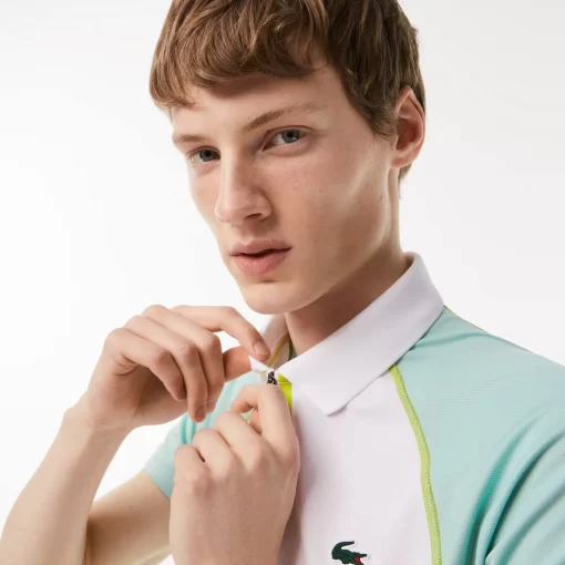 Lacoste Tennis>Herren Tennis Poloshirt Aus Recyceltem Polyester Mit Ultra-Dry-Technologie Weis / Hellgrun / Gelb Awc