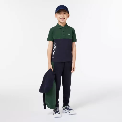 Lacoste Jungenkleidung>Kinder Poloshirt Aus Bio-Baumwoll-Pique Mit Colourblock Dunkelgrun / Navy Blau Kzi