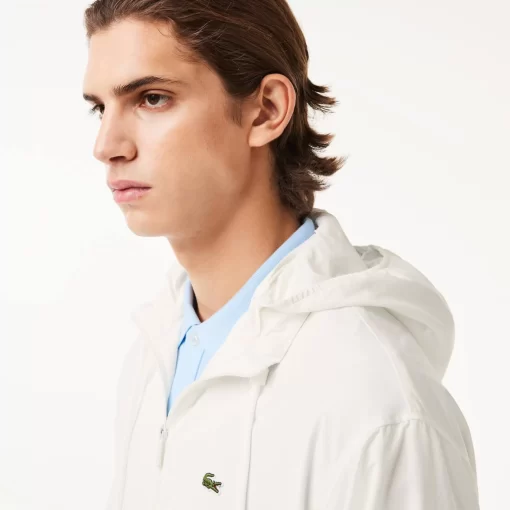 Lacoste Jacken & Mäntel>Kurze Wasserabweisende Trainings-Jacke Mit Abnehmbarer Kapuze Weis 70V