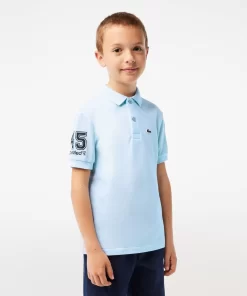 Lacoste Jungenkleidung> Club Med Kinder Polo Hellblau T01