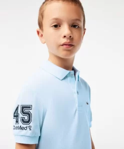 Lacoste Jungenkleidung> Club Med Kinder Polo Hellblau T01