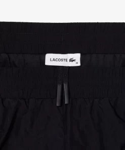 Lacoste Hosen & Shorts>Trainingshosen Aus Nylon Mit Weitem Hosenbein Navy Blau Hde