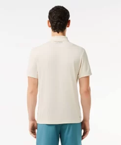 Lacoste Tennis>Ultra-Dry Pique Tennis Poloshirt Weis Avx