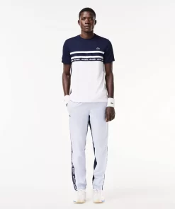 Lacoste Tennis>Ultra-Dry Tennis T-Shirt Aus Pique Mit Logostreifen Weis / Navy Blau 522