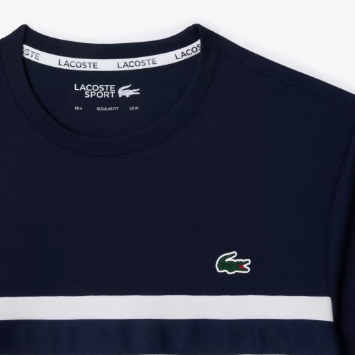 Lacoste Tennis>Ultra-Dry Tennis T-Shirt Aus Pique Mit Logostreifen Weis / Navy Blau 522