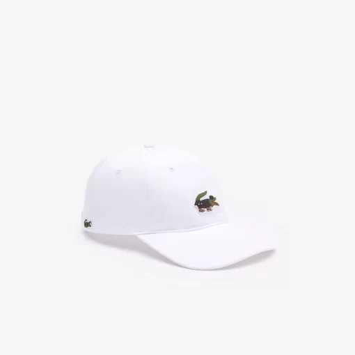 Lacoste Caps & Hüte>Unisex X Netflix Krokodil-Kappe Weis Vif