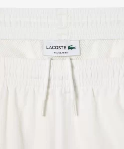 Lacoste Hosen & Shorts>Wasserfeste Trainingshosen Weis 70V