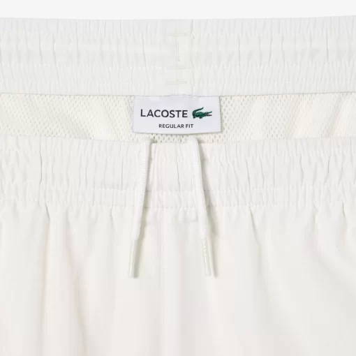 Lacoste Hosen & Shorts>Wasserfeste Trainingshosen Weis 70V